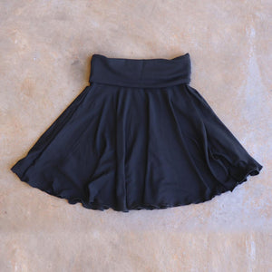 Girls full circle skirt with wide, yoga foldover waistband. Comfy fit and great for ballet class. Sizes to fit newborns, toddlers, kids and tweens up to 10 years old. Ethically handmade with soft, stretch bamboo spandex. Black