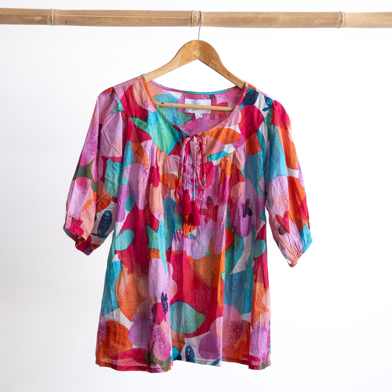A colorful artwork pink floral light cotton blouse