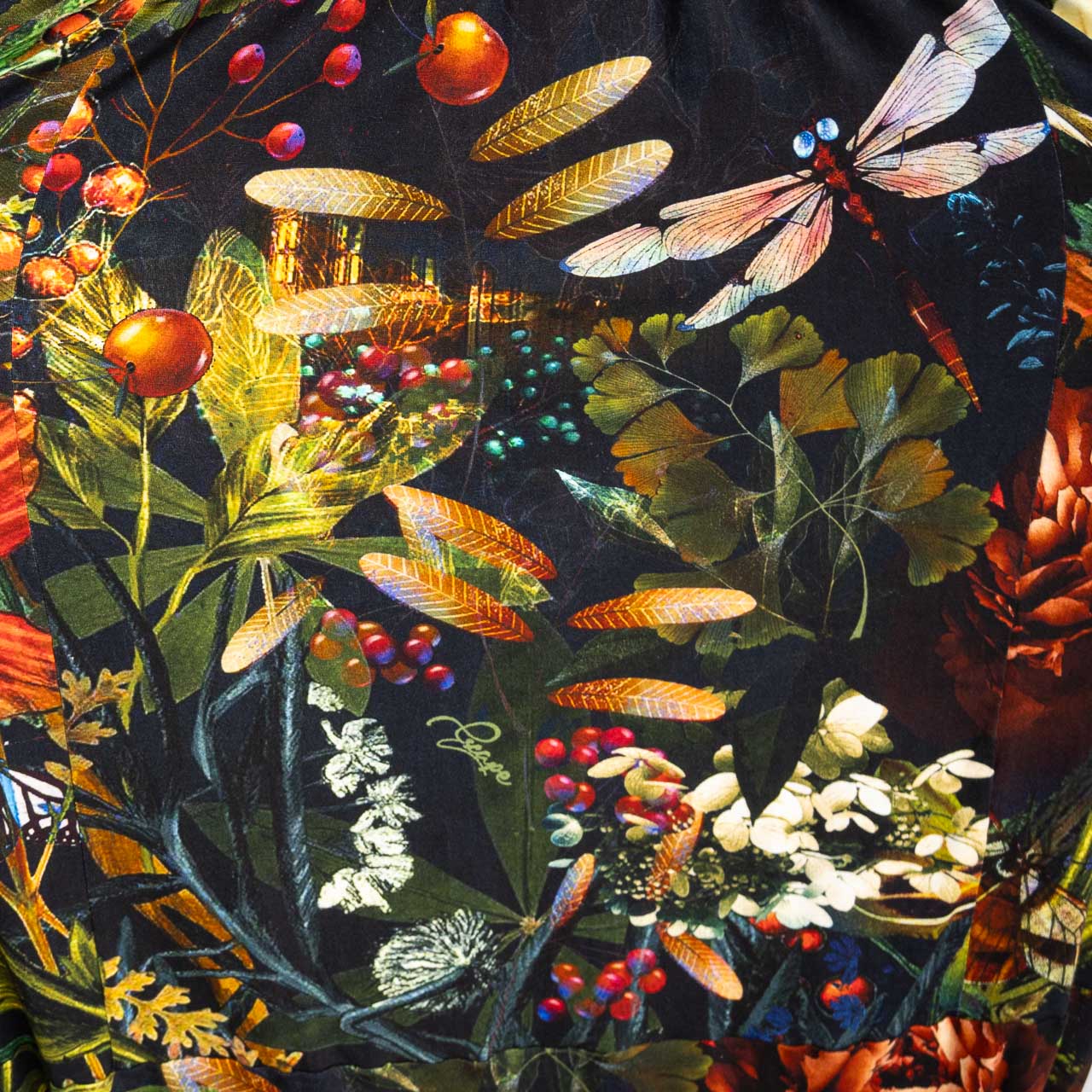 Colorful nature-themed fabric with leaves, flowers, and insects on a dark background
