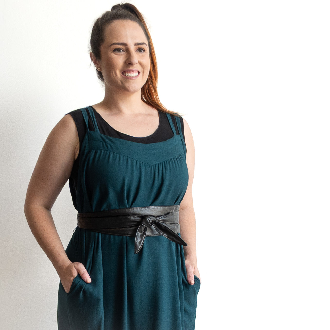 Shoestring midi sundress in a loose belted style in peacock green layered over a black bamboo tshirt