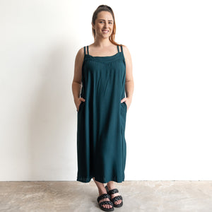Shoestring midi sundress in a loose, oversized style with two pockets in peacock green