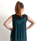 Shoestring midi sundress in a loose style in peacock green layered over a black bamboo tshirt