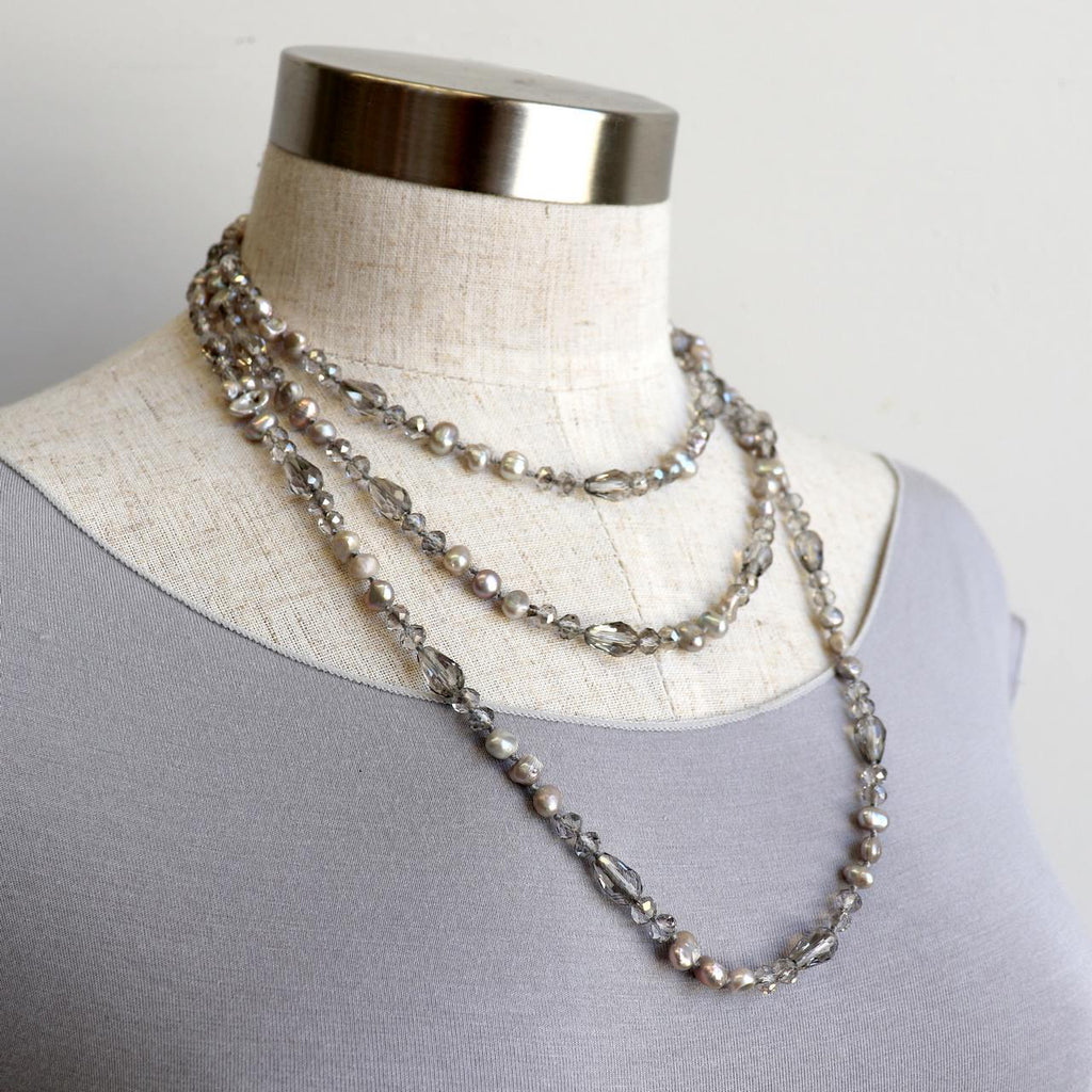 Freshwater pearls and cut glass beads. Hand knotted. 155cm full length. Silver.