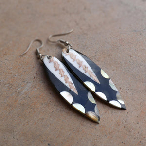 Classy + stylish mother of pearl earrings in a variety of shapes and patterns. Paired with a summer outfit for a beach-side look. Approx. 6cms in length.