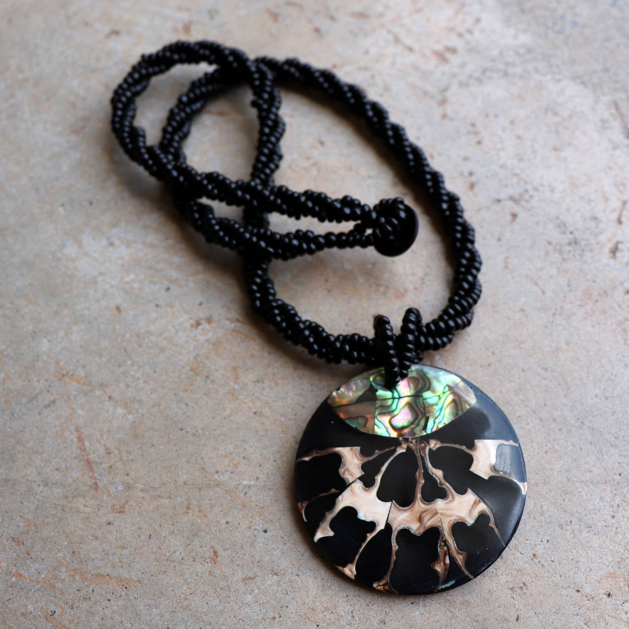 By The Sea Shore Necklace made with mother-of-pearl and glass beads in a tortoise shell pattern