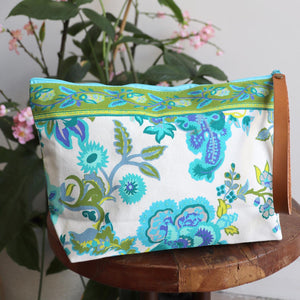 Zippered clutch handbag, a versatile clutch in a floral design perfect for cosmetics, phones or wallets. Generously sized, lightweight with a washable lining.