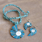 By The Sea Shore Necklace made with mother-of-pearl and glass beads in a tortoise shell pattern. Shell-Blue.
