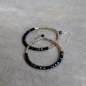 Handmade glass and metallic bead earrings. Black + Gold.