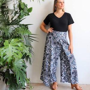 Free Spirit Wrap Pant in a modern palazzo style for lovers of animal print. Black. Front stance.
