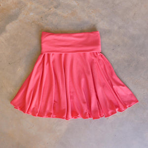 Girls full circle skirt with wide, yoga foldover waistband. Comfy fit and great for ballet class. Sizes to fit newborns, toddlers, kids and tweens up to 10 years old. Ethically handmade with soft, stretch bamboo spandex. Coral Pink
