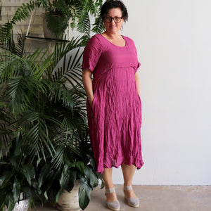 Womens below the knee summer dress is fully lined with side seam pockets. Chic + classic a-line shaping ,made with a lightly textured 65%-35% cotton/poly blend. Sizes 8/10 to 18/20. Magenta Pink.