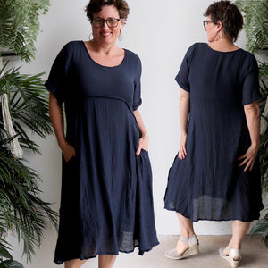 Womens below the knee summer dress is fully lined with side seam pockets. Chic + classic a-line shaping ,made with a lightly textured 65%-35% cotton/poly blend. Sizes 8/10 to 18/20.
