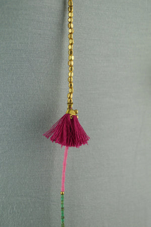 Long multi-coloured beaded necklace with colourful tassel fixtures. 