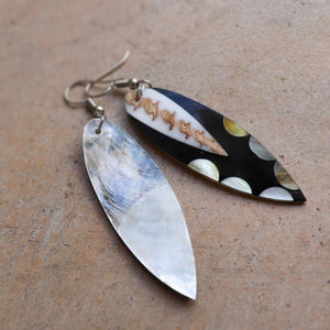 Classy + stylish mother of pearl earrings in a variety of shapes and patterns. Paired with a summer outfit for a beach-side look. Approx. 6cms in length.