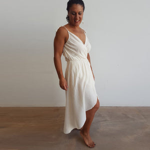 100% cotton spaghetti strap summer boho wrap dress with adjustable ties. Natural white.