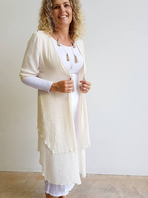 Make It Happen Long Layer Cardigan is a lightweight summer cover-up. Nude Beige.