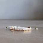 Classic art deco styling, featuring two rows of fine brass and glass beads all hand-knotted using traditional ethnic techniques. Gold & Pink Medley.