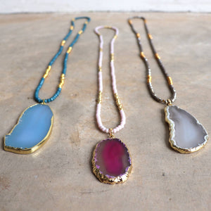 Stunning glass and stone statement necklace with gold metallic hightlights. 