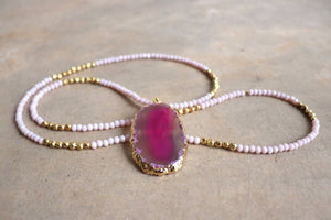 Stunning glass and stone statement necklace with gold metallic hightlights. Pink.