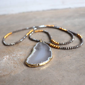 Stunning glass and stone statement necklace with gold metallic hightlights. Storm Grey.