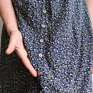 Women's Dresses Palm Beach Dress in pretty Woodland Flowers is a romantic summer style. Navy Blue print close-up.