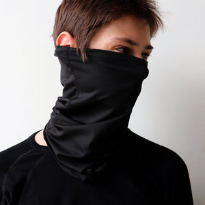 Protect-A-Neck Scarf Mask is a silky soft, stretchy poly/spandex tube scarf + face mask + headband. Collingwood Black.. Mask view.