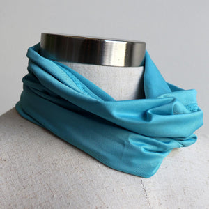 Protect-A-Neck Scarf Mask is a silky soft, stretchy poly/spandex tube scarf + face mask + headband.  Sharkies Blue.