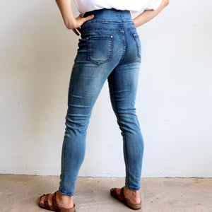 Shaper Denim Jeans - mid-rise stretch pull-on jegging in plus size. Back side view.