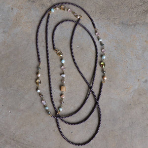 Long strand necklace that can be layered up to 3 times around.  Handmade in all glass beads with baroque pearl highlights.