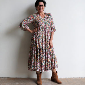 Our Sunday Best Midi Dress is flowing floral frock in a long, classic boho style. Front view.