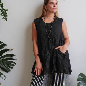 Take It Easy women's button-through sleeveless tunic top. Perfect summer travel shirt made from 100% cotton with handy side pockets. Sizes S/M-L/XL. Black.