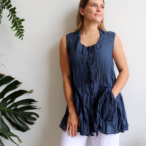 Take It Easy women's button-through sleeveless tunic top. Perfect summer travel shirt made from 100% cotton with handy side pockets. Sizes S/M-L/XL. Navy.