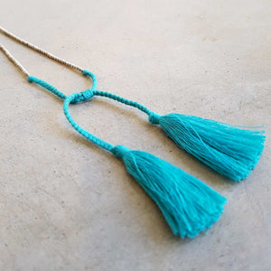 Silver and Blue metallic bead necklace with tassel. 