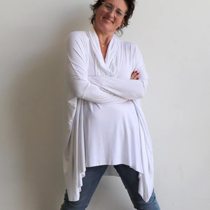 Our Glider Poncho Tee made in bamboo is a cowl neck plus size winter kaftan top. White. Crossed arms.
