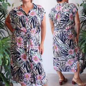 Ladies collared, short cuffed sleeved, button-up, midi, shirt dress with a waist tie in a fresh floral print for spring to summer wear. Super soft draping 100% rayon fabric with a relaxed and generous fit to suit petite to plus sizes up to 22.