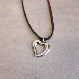 Heart shaped silver pendant combined with a natural leather band available in 3 colours, Black, Silver and Tan