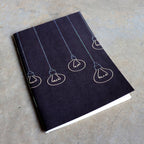 32 blank page notebook. 10cm x 14cm dimensions.