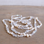 Freshwater pearls and cut glass beads. Hand knotted. 155cm full length. Ivory.