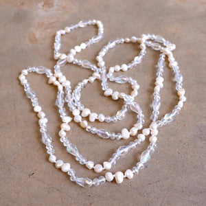 Freshwater pearls and cut glass beads. Hand knotted. 155cm full length. Ivory.