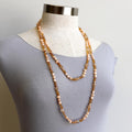 Freshwater pearls and cut glass beads. Hand knotted. 155cm full length. Rose.