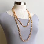 Freshwater pearls and cut glass beads. Hand knotted. 155cm full length. Rose.